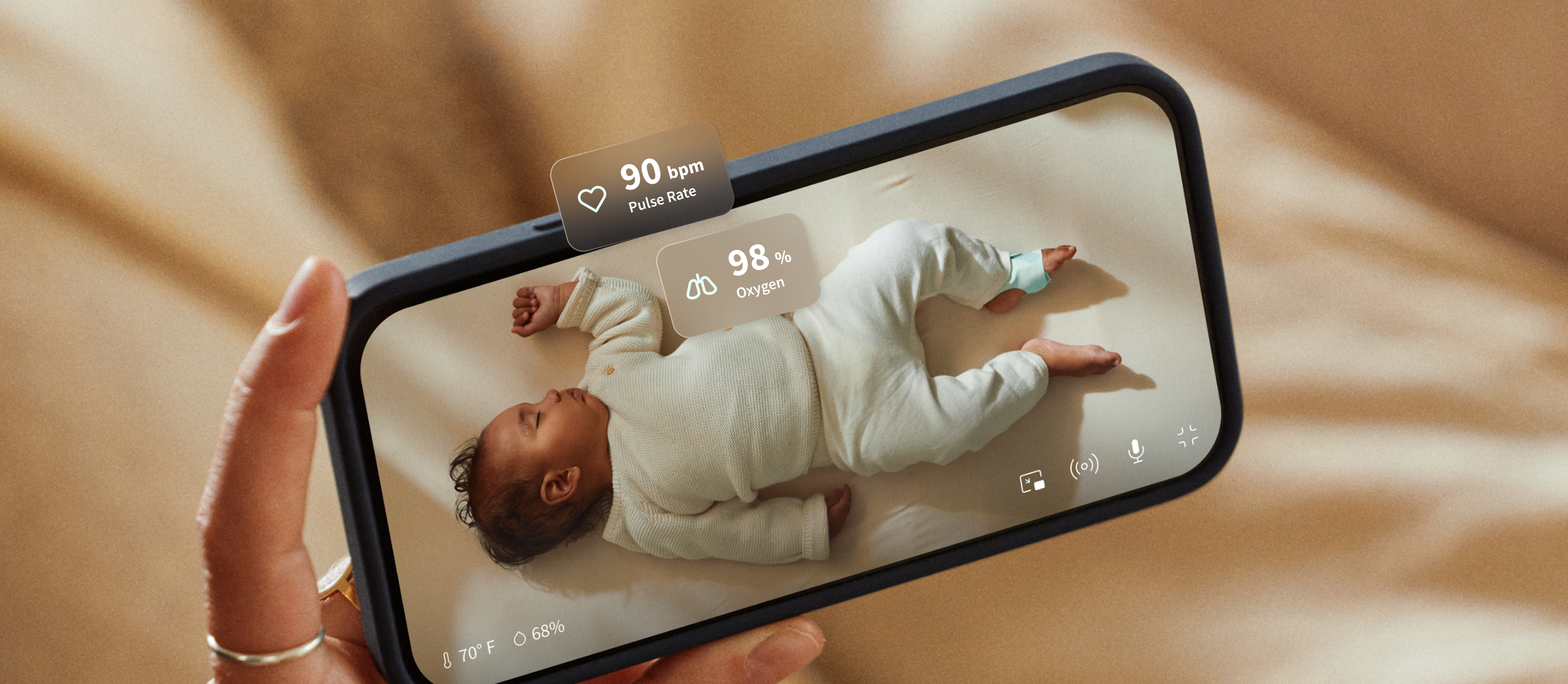Parent watching baby on Owlet app