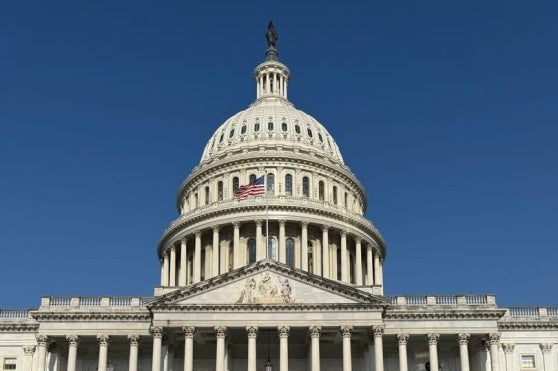 The U.S. Capitol building under a clear blue sky